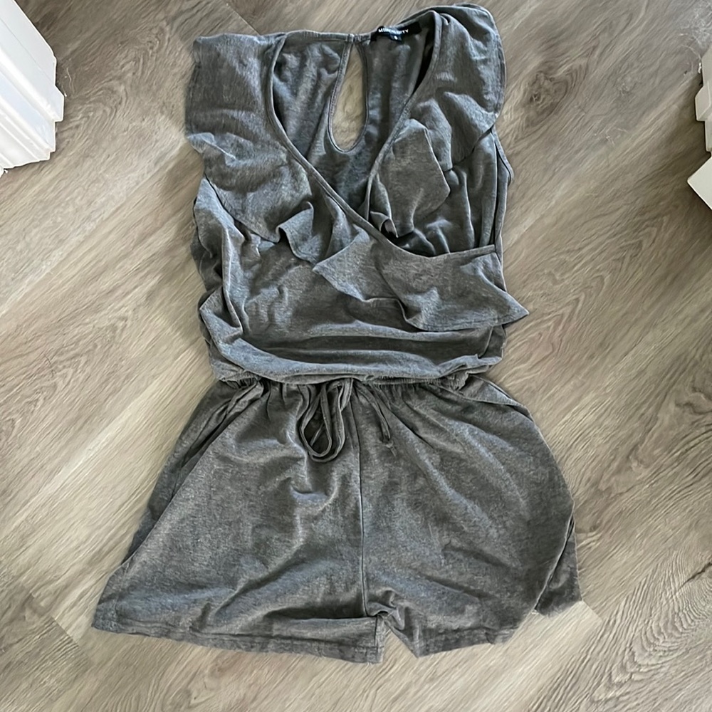 Womens gray romper size small with ruffle detail